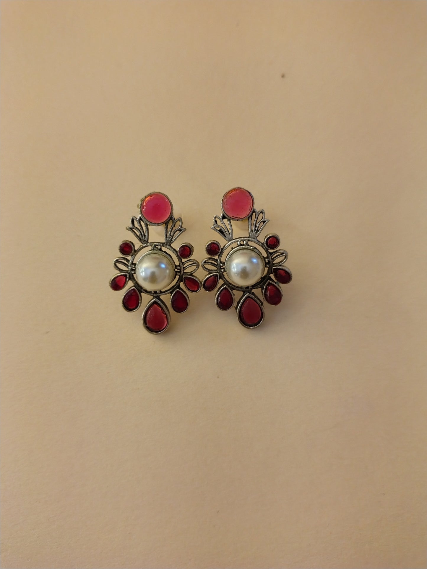 Elegant Ruby-Tone Stud Earrings with Central Pearl Accent